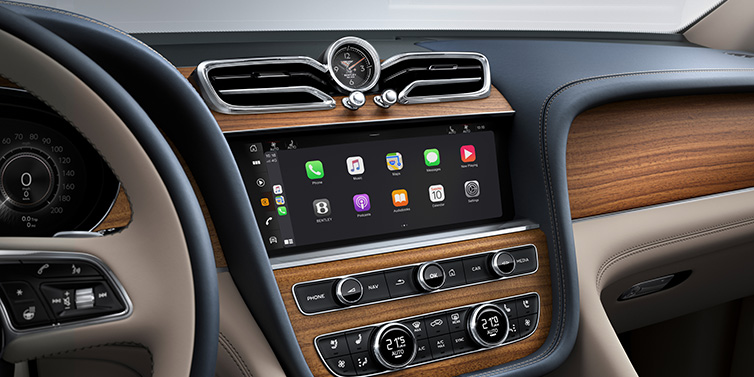 Bentley Seoul Bentley Bentayga Extended Wheelbase Azure SUV front interior centre console with MMI screen showing apps, surrounded by Portland and Imperial Blue coloured hides